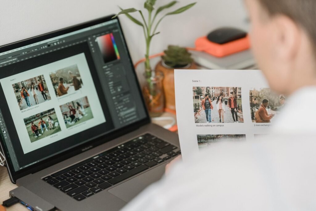 From Photoshop Purgatory to AI Paradise: How Face-Swapping Technology Rescued My Visual Content Workflow woman working on laptop