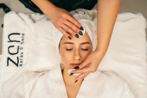 A woman in white laying on bed