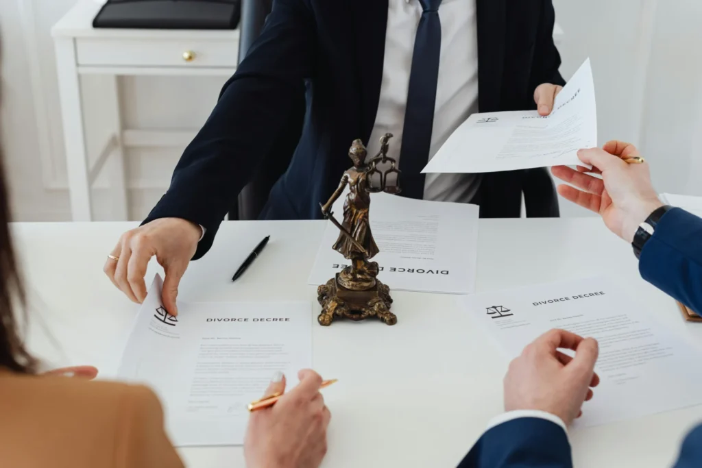 people holding divorce papers