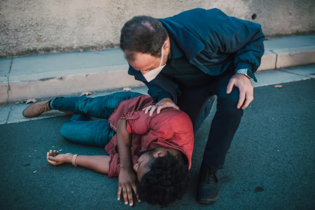 Understanding Michigan's Comparative Fault in Injury Claims a man is lying on road