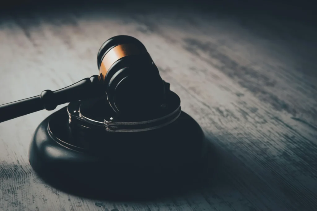 a judge hammer on wooden table