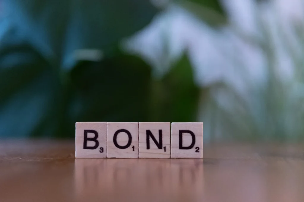 word bond written with scrabble
