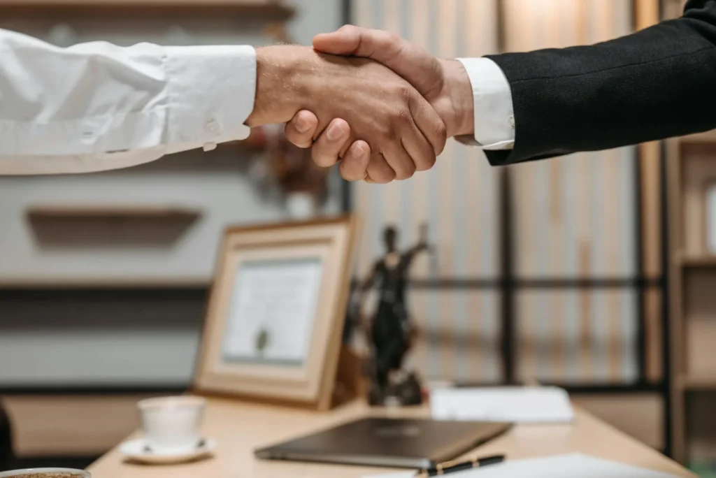 two people are shaking hands
