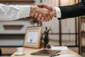 two people are shaking hands