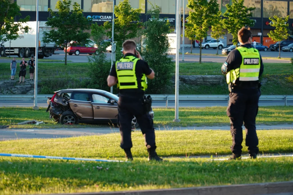 Understanding Michigan's Comparative Fault in Injury Claims two police officers are standing in front of car