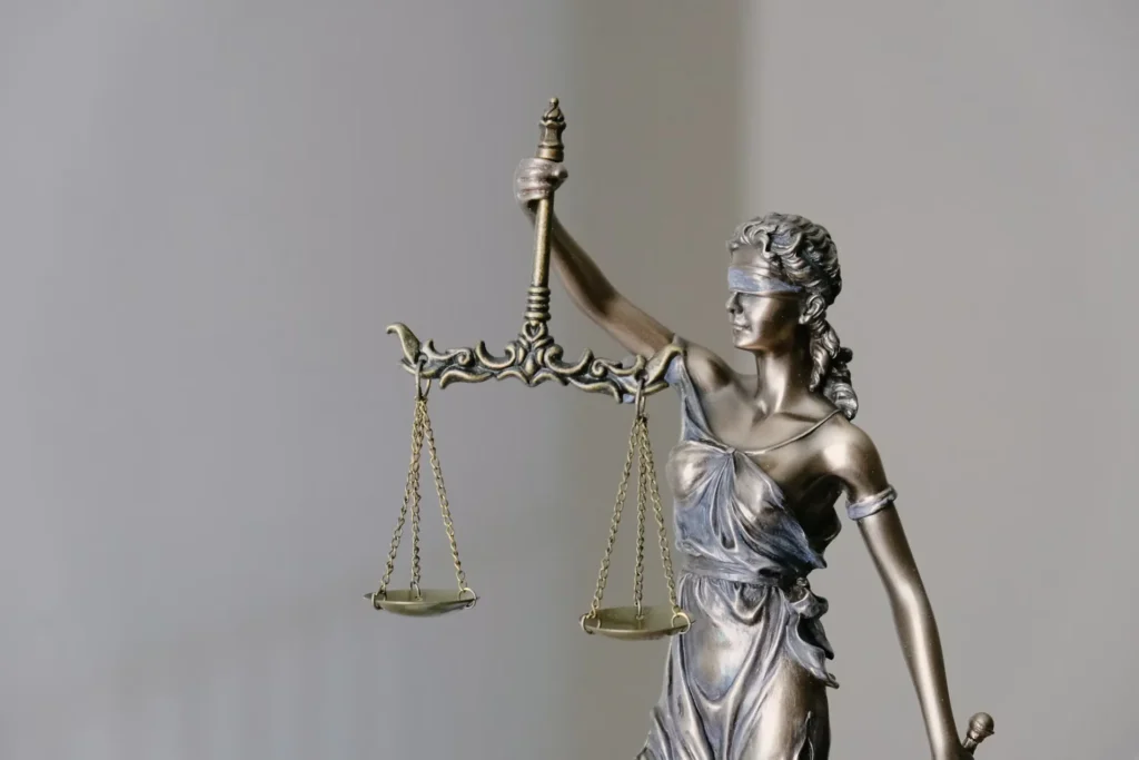 Can You Still Get a Settlement If You Were Partly to Blame for an Accident? woman holding fingurine