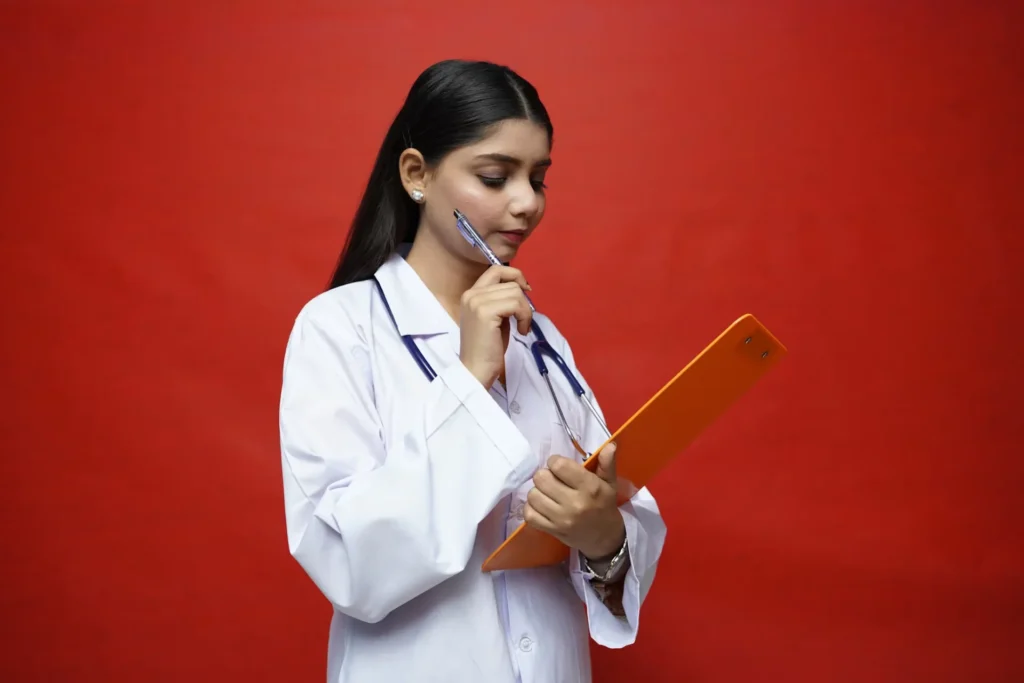 6 Essential Steps to Secure Your Spot in Postgraduate Medicine Studies in Australia a woman holding clipboard