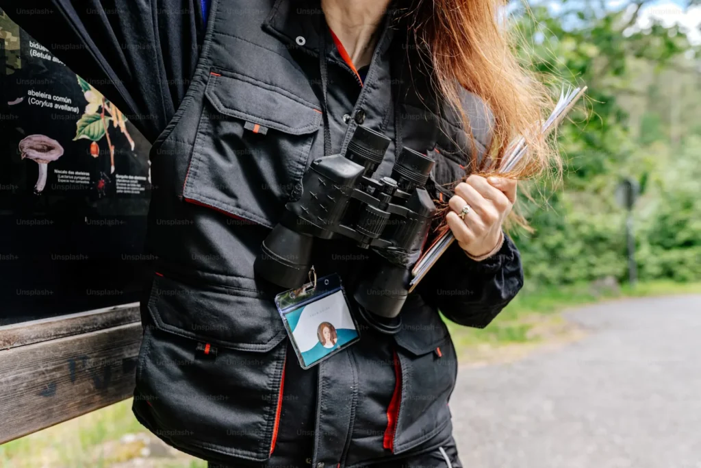 Tips for Choosing Reliable ID Card Printers for Manufacturing A woman wearing ID card and field glasses