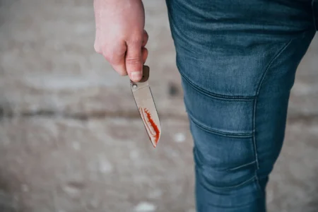 A man holding a knife.