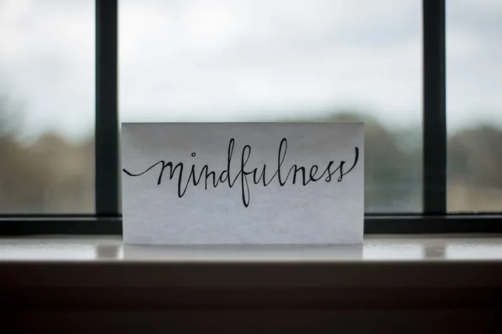 Boosting Workplace Efficiency: How Business Owners Can Improve Employee Comfort and Productivity Word MINDFULNESS printed on a paper