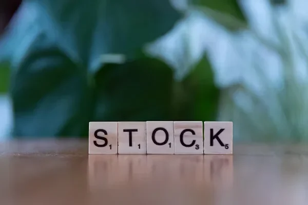 Index Funds vs. ETFs vs. Individual Stocks: Pros and Cons Word stock written with scrabbles
