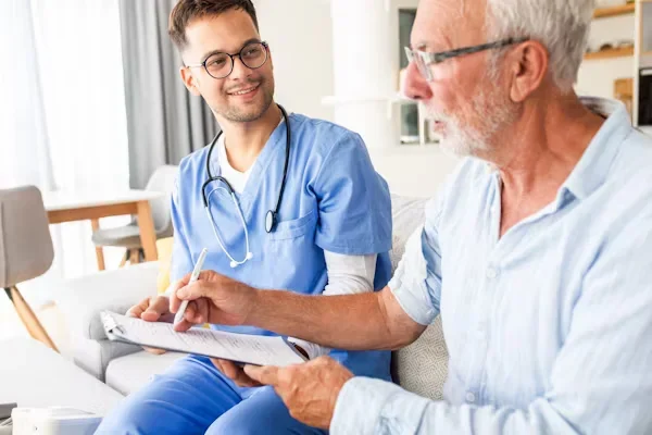 Your Guide to Reimagining Patient-Centered Care for Tomorrow’s Needs a doctor and patient sitting on couch