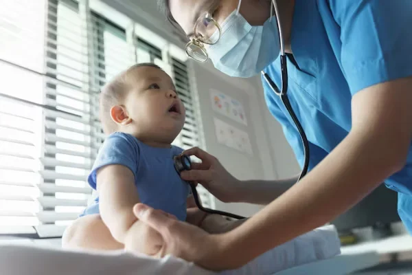 What You Should Learn About Neonatal Nurse Incursions a female nurse checking baby's heartbeat