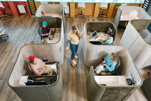Boosting Workplace Efficiency: How Business Owners Can Improve Employee Comfort and Productivity group of people sitting on different desk