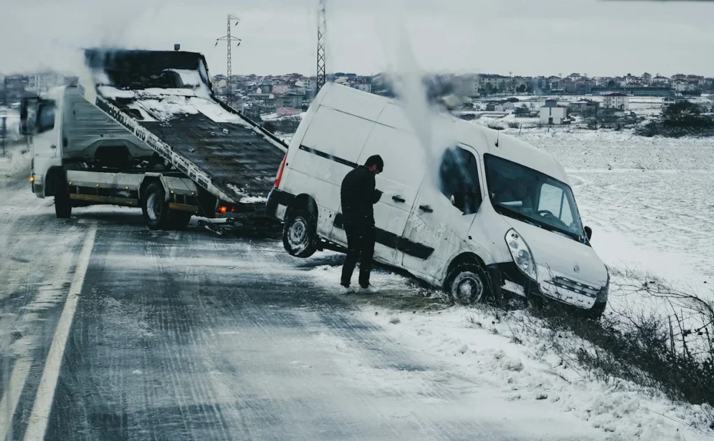 Top Mistakes to Avoid After a Truck Accident a man standing next to a white van on the side of road