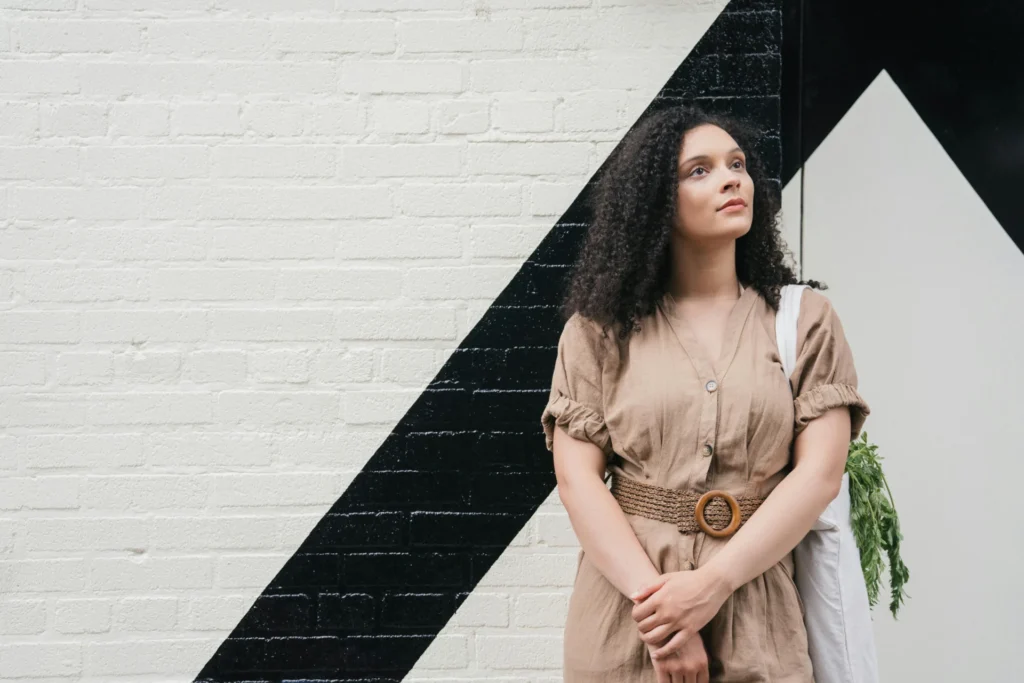 a woman standing in fron of the wall