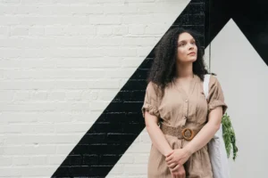 a woman standing in fron of the wall