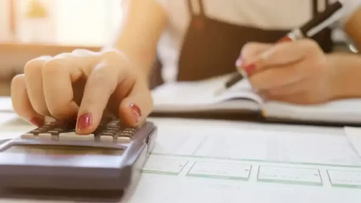 Breaking Down the Costs of Hiring a Felony Defense Attorney woman using calculator