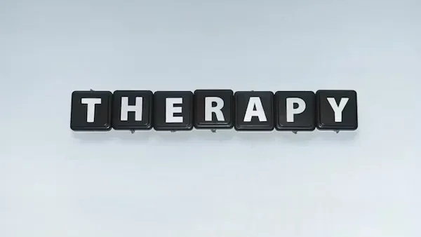 Discovering Hybrid Therapy: A Balanced Approach to Mental Wellness Black and white letters
