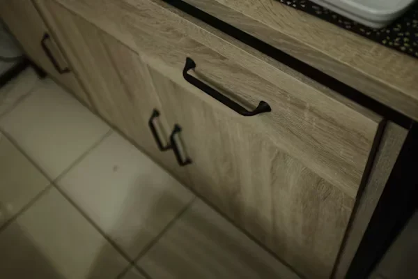 Why Custom Cabinet Hinges Are a Game Changer for Unique Furniture Designs brown cabinets with black handles