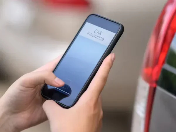 What to Do After a Traffic Accident man holding cell phone in his hands