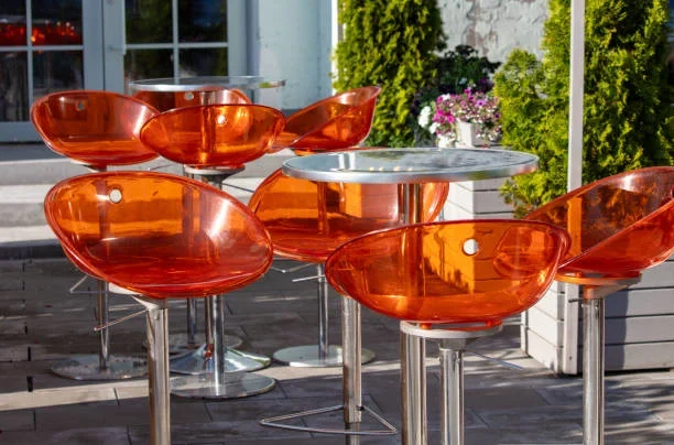 The Impact of Innovative Acrylic Products on Interior Design Orange round chairs with coffee tables