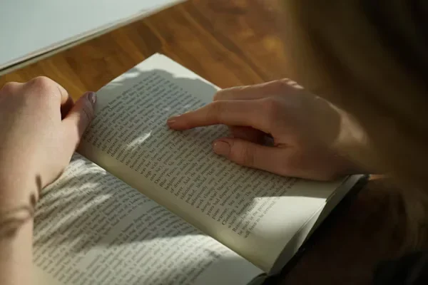 That Guides: David Carter’s Odyssey of Faith and Miracles person reading a book