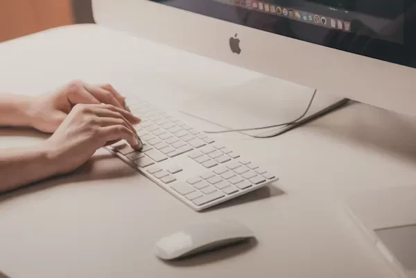 From Safe Mode to System Scan: A Proven Mac Malware Cleanup Plan person typing on keyboard