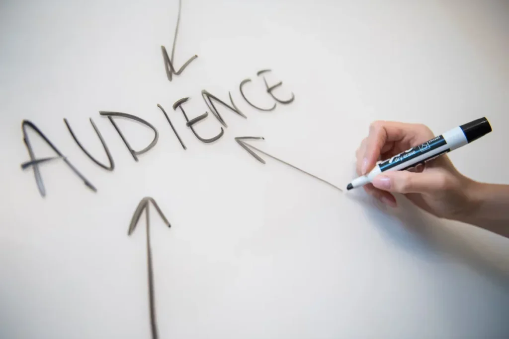 How Can a Virtual Assistant Simplify Local News Marketing? person writing on white board