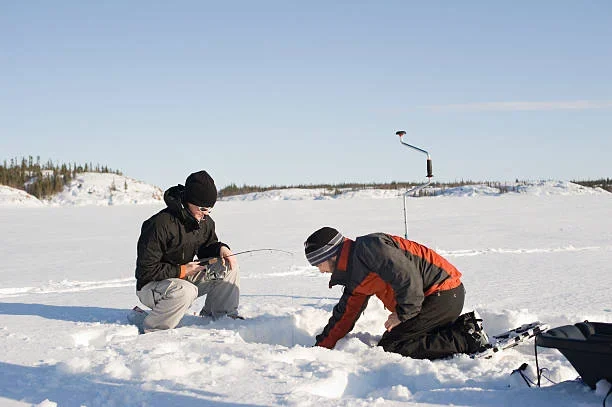 Ice Fishing in Fairbanks: A Thrilling Winter Adventure two people ice fishing