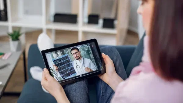 Discovering Hybrid Therapy: A Balanced Approach to Mental Wellness woman is talking to her doctor