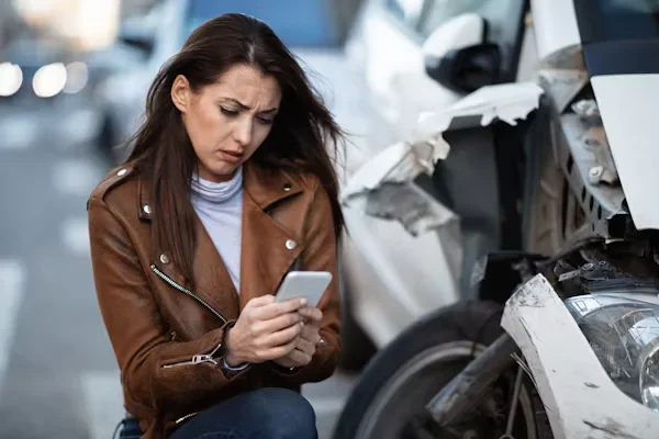 What to Do After a Traffic Accident woman using phone