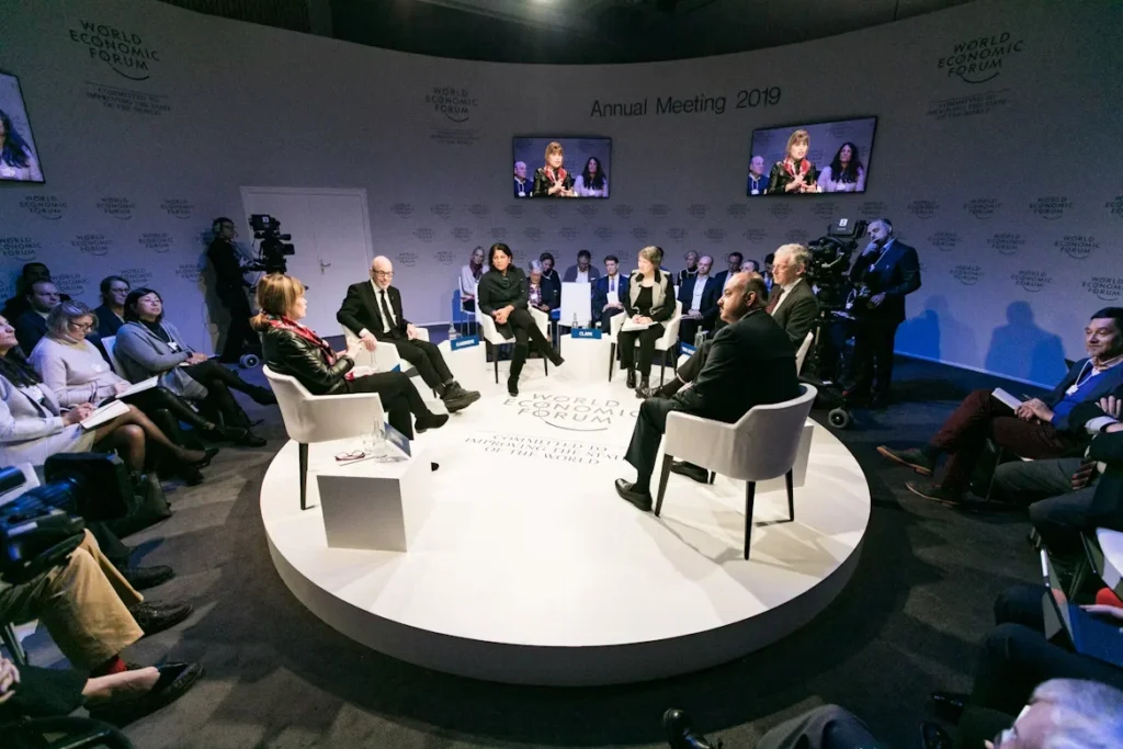 A group of people sitting in a room