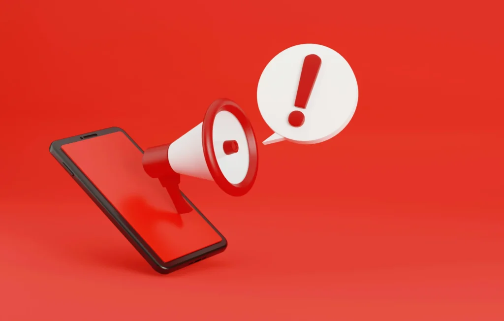 A phone with warning signs.