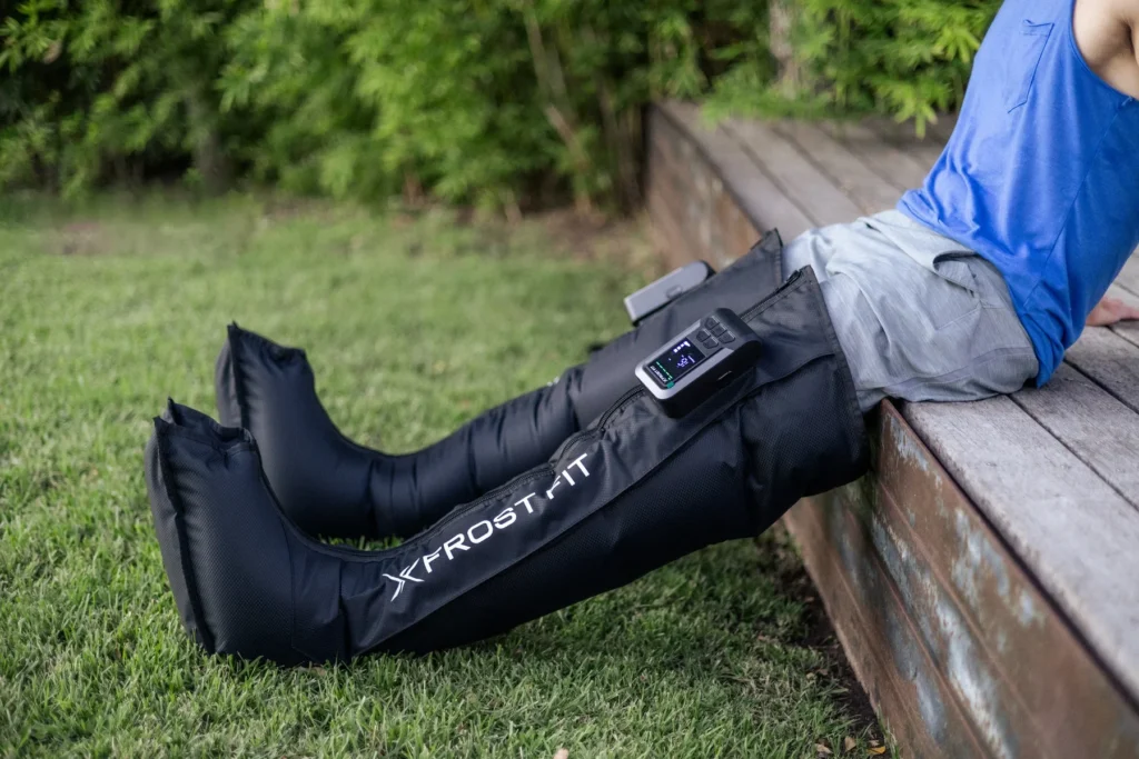 7 Surprising Benefits of Compression Boots for Recovery Legs a man wearing long boots