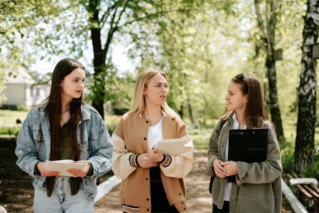 Why Campus Security Is Priority For Educational Institutions? a group of girls talking to each other