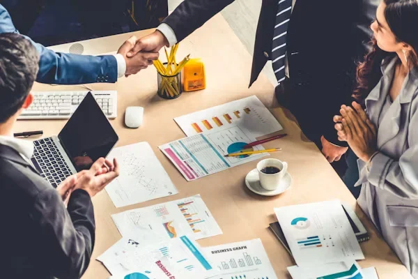 How to Influence Without Authority: A Corporate Manager’s Guide to Leadership a group of people sitting on a table