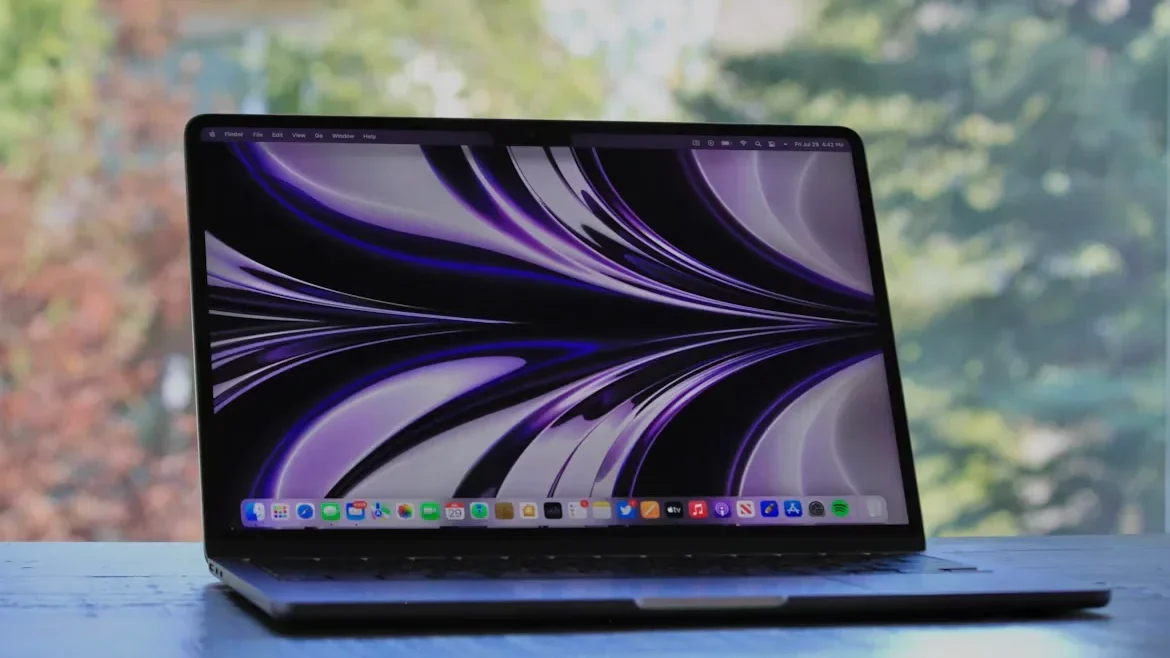 Is the Refurbished 2017 MacBook Air Still Worth It in 2025? a laptop with a purple screen