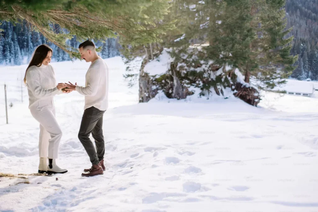 How to Plan the Perfect Proposal in Alaska a man and woman standing in the snow