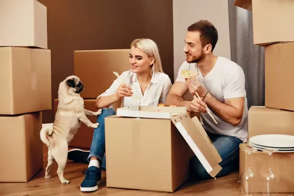 Who Can Benefit from Dog Boarding Services a man and woman with their dog.
