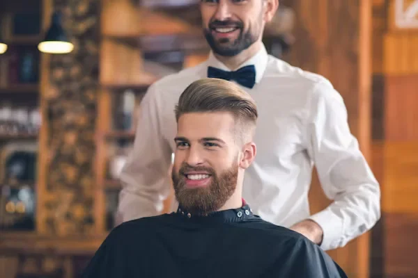 Summer Short Haircuts for Men | Short Hairstyles 2025 a man looking in mirror smiling