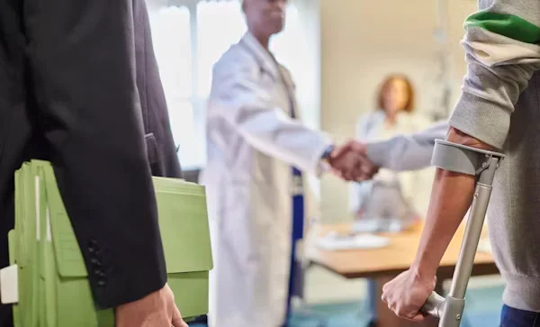 Statute of Limitations Issues in Michigan Personal Injury Cases a patient and doctor shaking hands