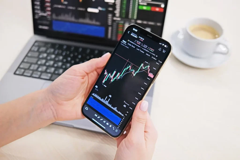Cryptocurrency Auto Invest A Tool to Simplify Crypto Portfolio Management a person holding a cell phone