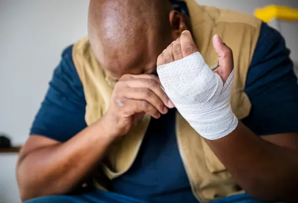Statute of Limitations Issues in Michigan Personal Injury Cases a tensed man having bandage on his hand