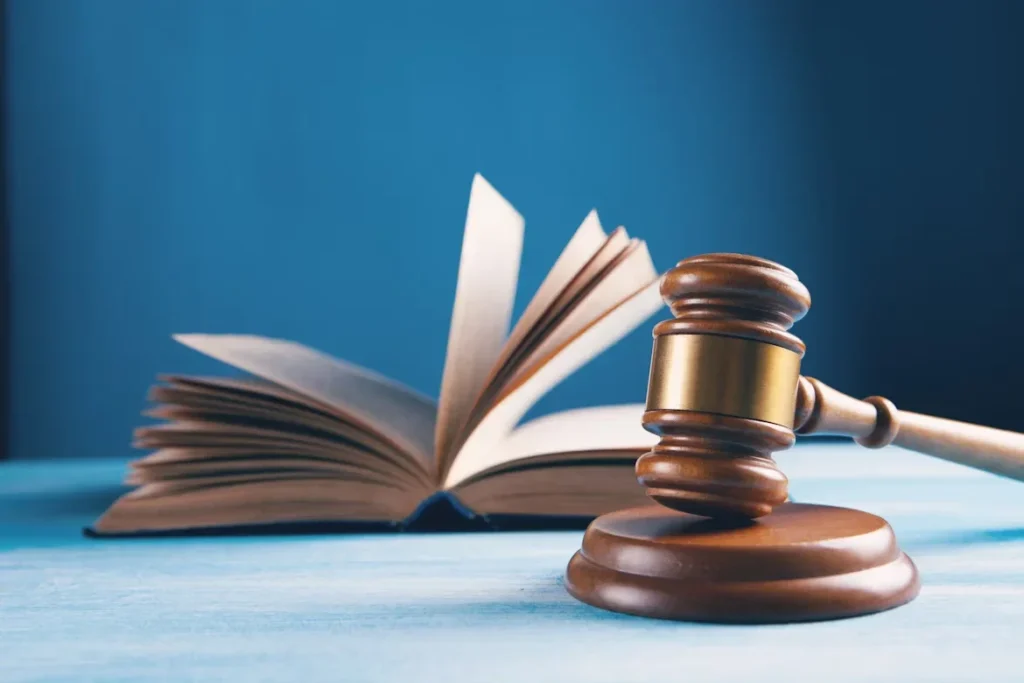 Who Can File a Wrongful Death Claim After a Tragic Loss? open book and wooden gravel on table