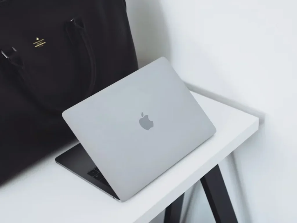 opened mac book on table