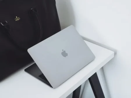 opened mac book on table