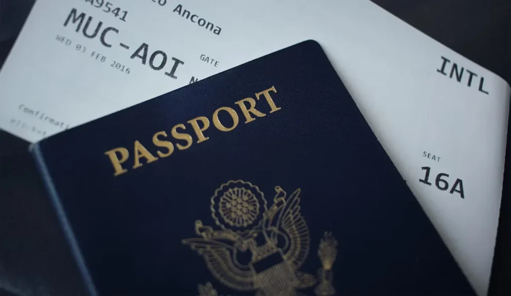 passport booklet on top of white paper.