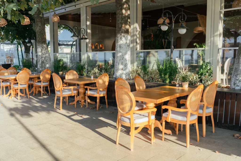 Why French Bistro Chairs Are the Ultimate Blend of Style and Durability in Cold Climates table and chair outside a restaurant
