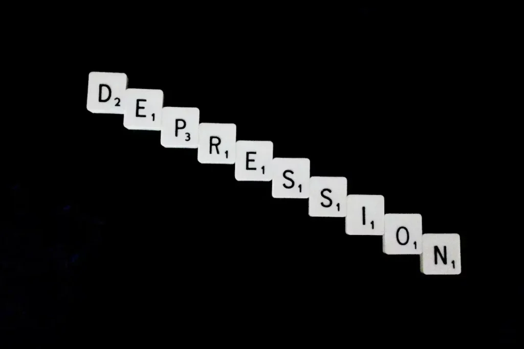 The Emotional Losses You Can Recover Through a Car Accident Claim word DEPRESSION written with white scrabble tiles